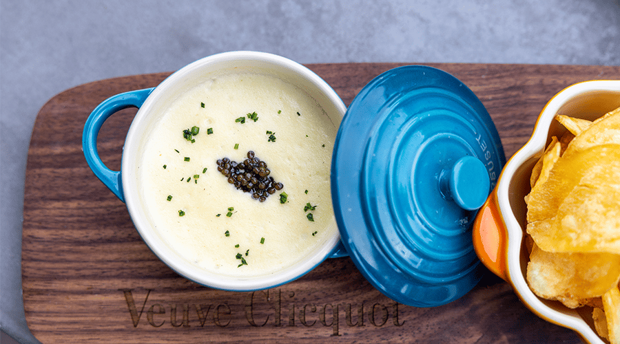 The menu features plenty of dishes with caviar, like this potato dip