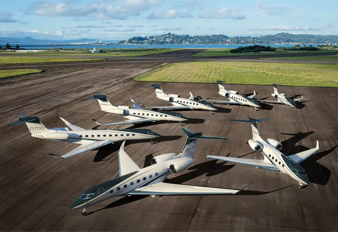 Various models of Private Jets parked on a private airstrip