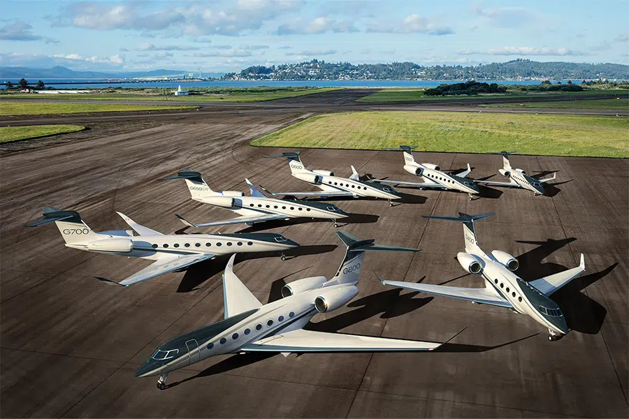 Various models of Private Jets parked on a private airstrip
