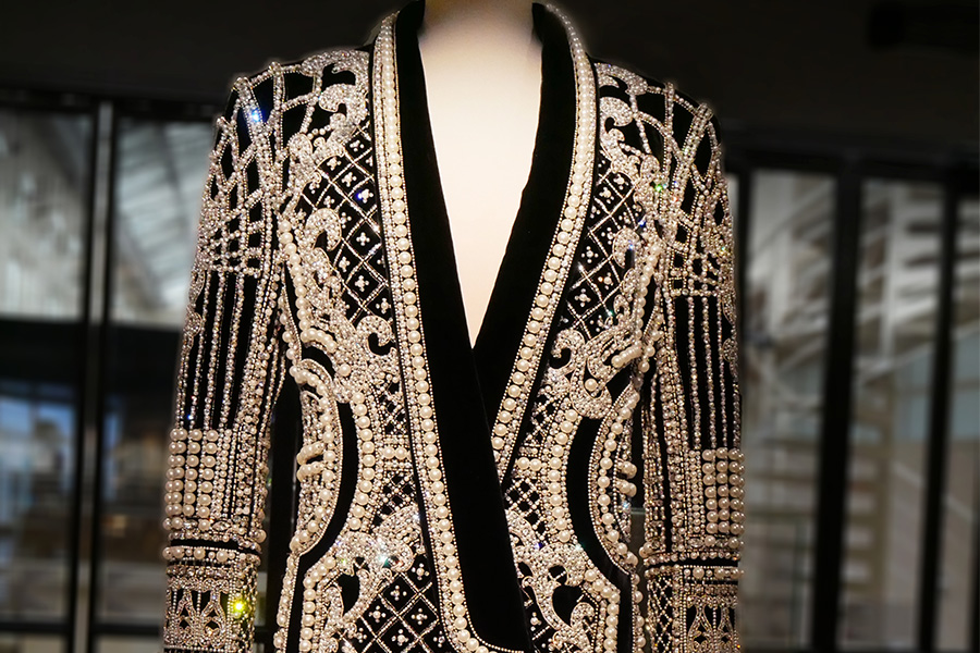 luxurious black velvet blazer A luxurious black velvet blazer adorned with intricate silver beading and embellishments