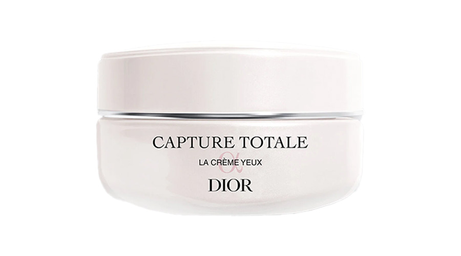 A white jar labeled Capture Totale La Crème Yeux Dior against a plain white background. The jar has a minimalist design with black and gray text.