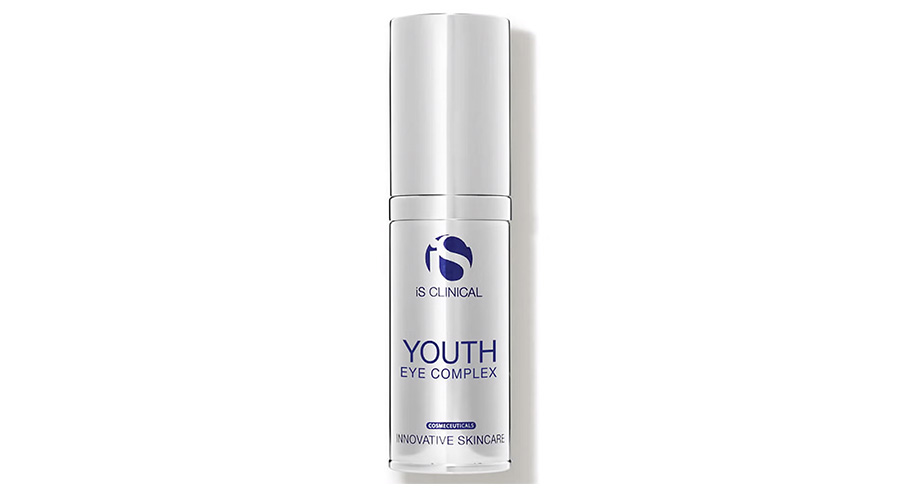 A white bottle of iS CLINICAL Youth Eye Complex skincare product with blue and silver text, standing upright against a plain white background.