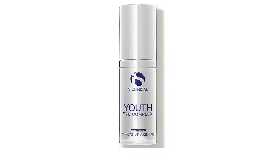 A white bottle of iS CLINICAL Youth Eye Complex skincare product with blue and silver text, standing upright against a plain white background.