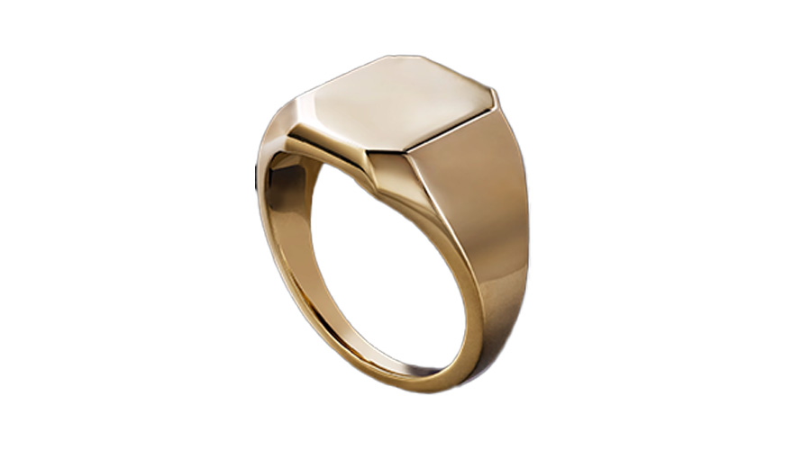 A gold signet ring with a smooth, blank, hexagonal face, shown against a white background.