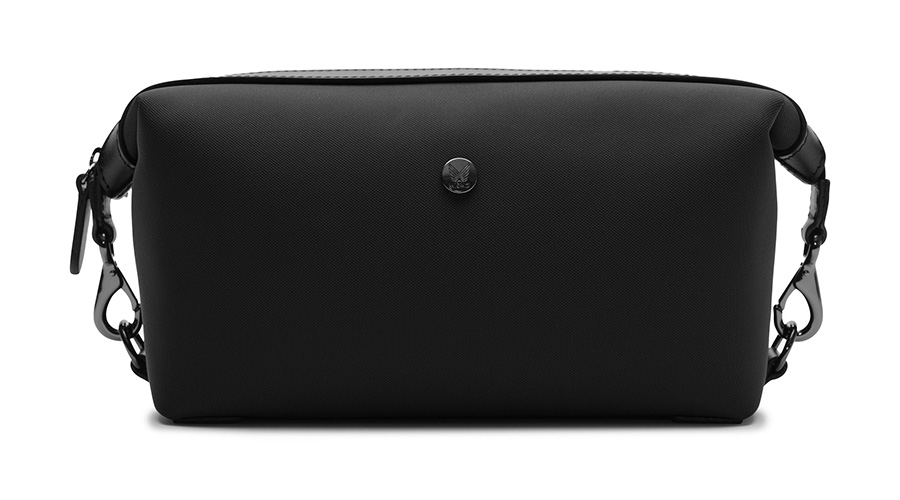 A black rectangular toiletry bag with a zipper closure, small metallic emblem on the front, and detachable clasps on both sides.