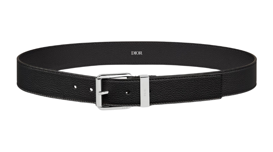 A black textured leather belt with a silver rectangular buckle and DIOR logo printed at the center of the belt.