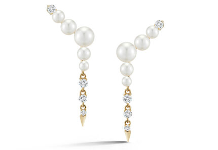 Gold earrings with four white pearls each, descending in size, connected to three sparkling round diamonds and ending in a small gold spike at the bottom. The earrings are displayed on a white background.