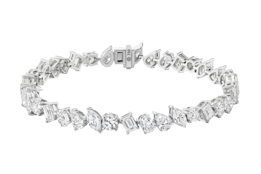 A diamond tennis bracelet featuring various cuts of diamonds set in a white metal band with a clasp closure.