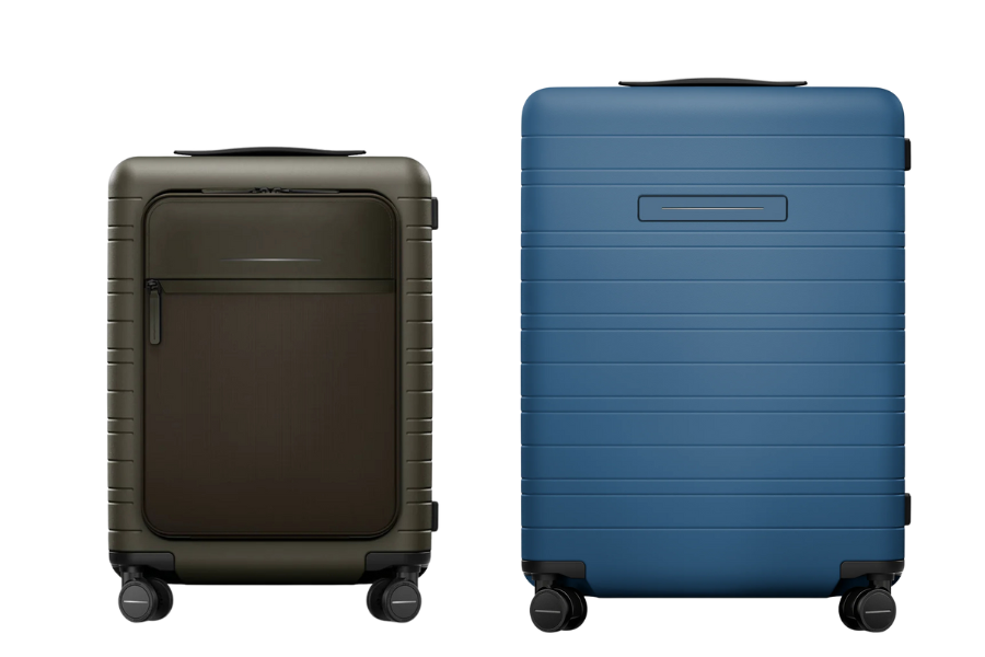 Two hard-shell suitcases with four wheels each are shown side by side. The left suitcase is smaller, olive green with a front zipper pocket, and the right suitcase is larger, solid blue with a smooth, ridged design.