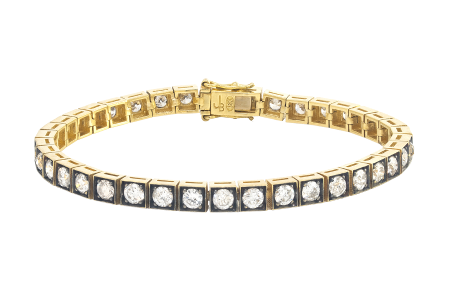 A gold tennis bracelet featuring a row of square settings, each holding a round white diamond, displayed against a white background.