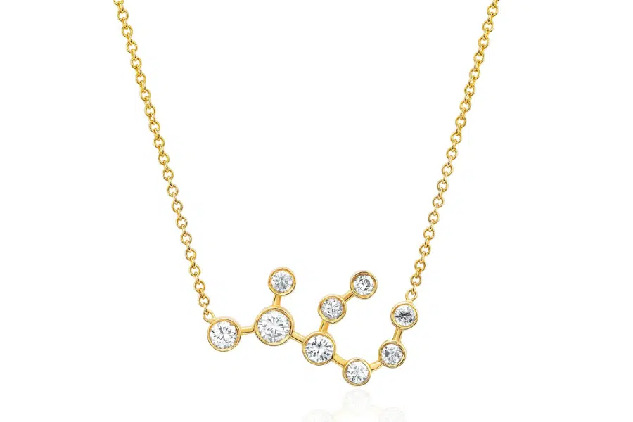 A gold chain necklace featuring a constellation-shaped pendant set with small round diamonds at each star point.