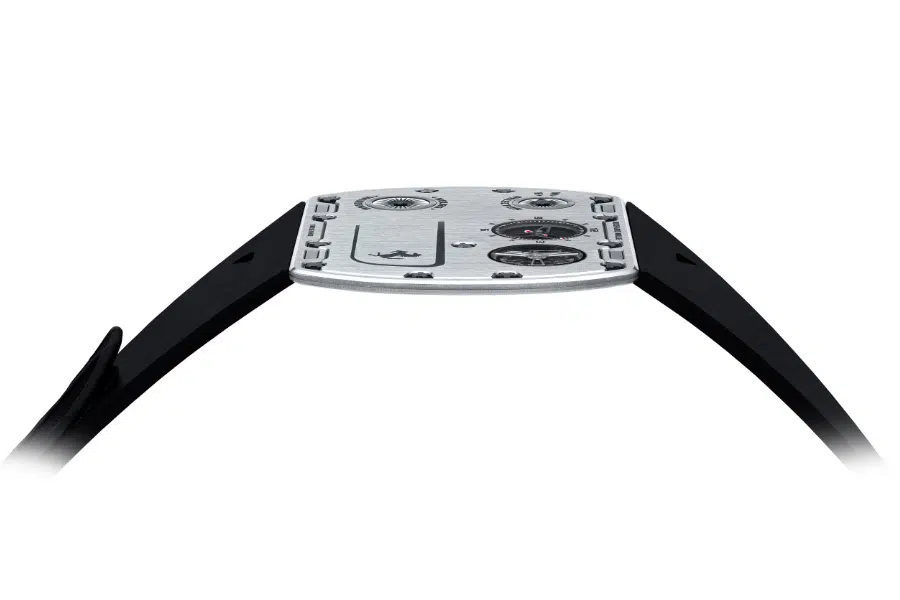 A side view of an ultra-thin wristwatch with a silver face, black strap, and minimalistic design, highlighting the slim profile and exposed screws on the watch face.