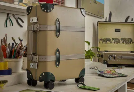 Globe-Trotter brand luggage in tan, featuring a custom hand-painted design