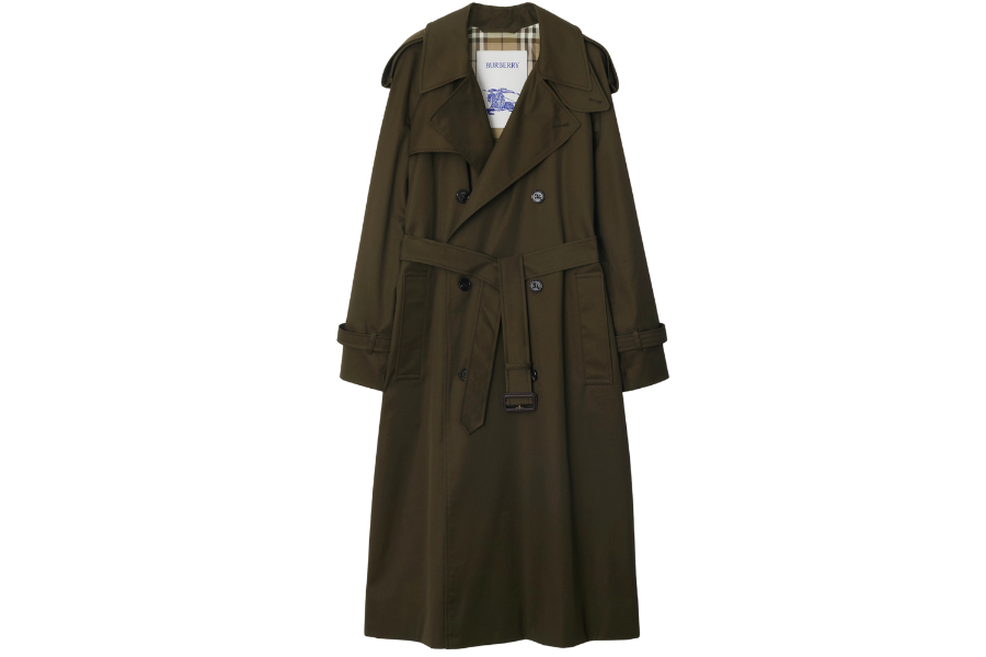 A long, dark green trench coat with a belt at the waist, double-breasted buttons, shoulder epaulets, and a plaid lining visible inside the collar.