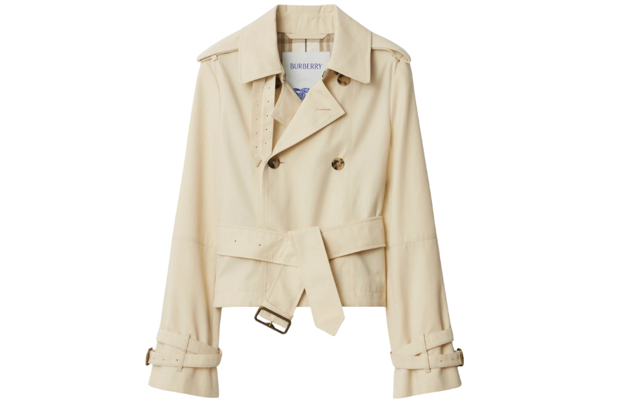 A beige, double-breasted trench coat with a belted waist and cuffs, featuring wide lapels and two brown buttons on the front. The label inside the collar reads Burberry.