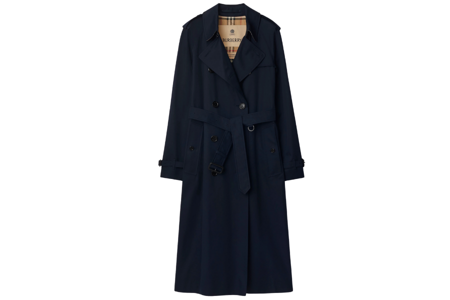 A long, dark navy blue trench coat with a belt at the waist, double-breasted buttons, and a beige plaid lining visible at the collar.