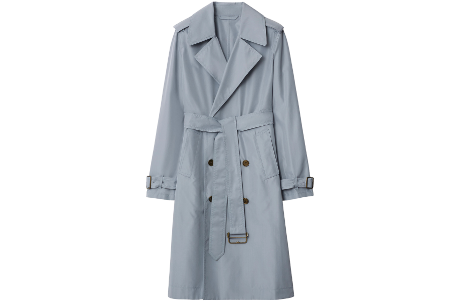 Light blue trench coat with wide lapels, a belted waist, and matching belt at the cuffs. The coat features front buttons and deep pockets, creating a classic, tailored look.