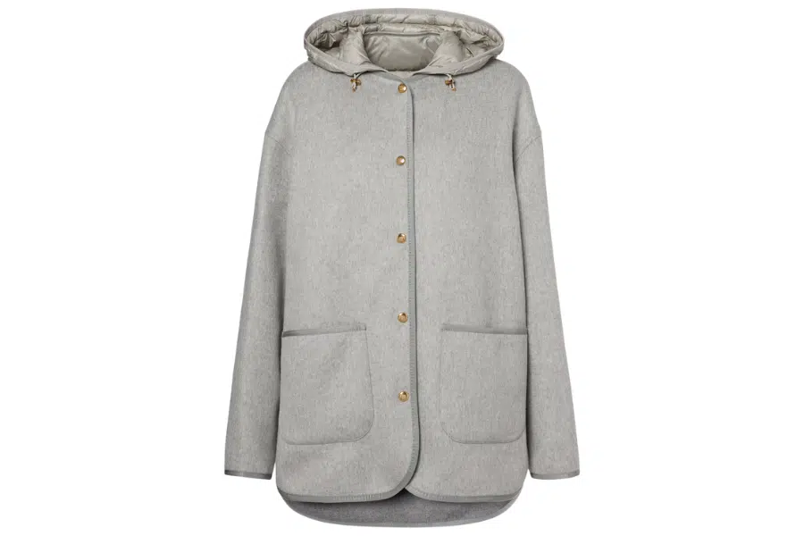 Light grey hooded coat with large front pockets, gold-tone snap buttons, and a rounded hem. The coat has a soft texture and a relaxed, loose fit.