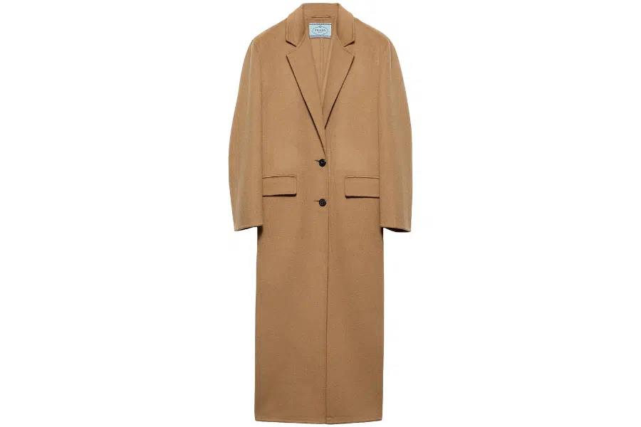 A long camel-colored overcoat with a notched lapel collar, two front buttons, and flap pockets, displayed against a white background.