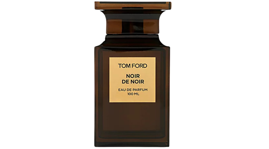 A dark brown rectangular bottle of Tom Ford Noir de Noir Eau de Parfum, 100 ml, with a gold label displaying the brand and fragrance name.