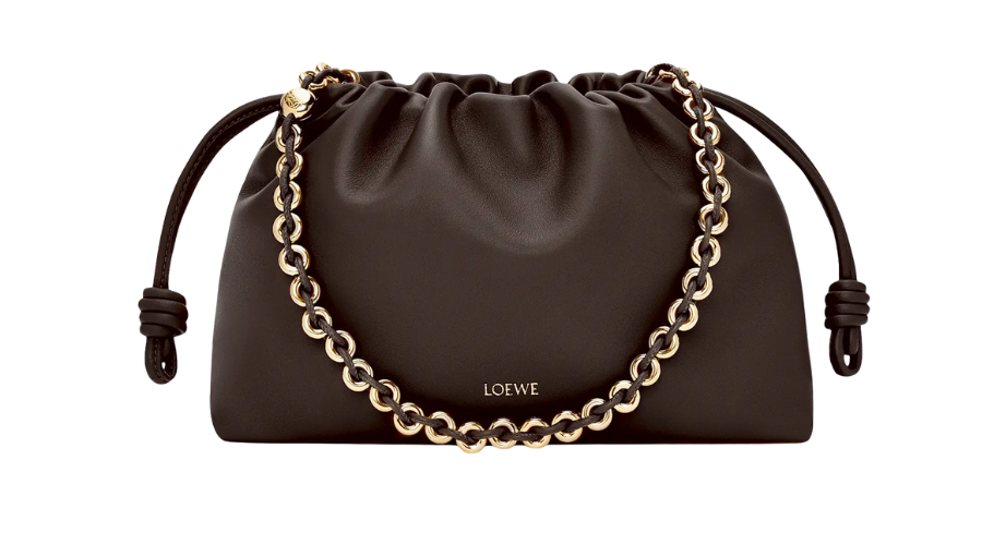 A black Loewe clutch bag with a gathered, drawstring top and a gold chain handle, displayed against a white background.