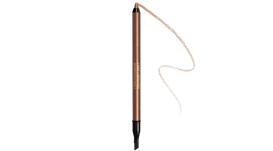 A brown eyebrow pencil with a black spoolie brush on one end and a brown line drawn from the pencil tip, shown on a white background.