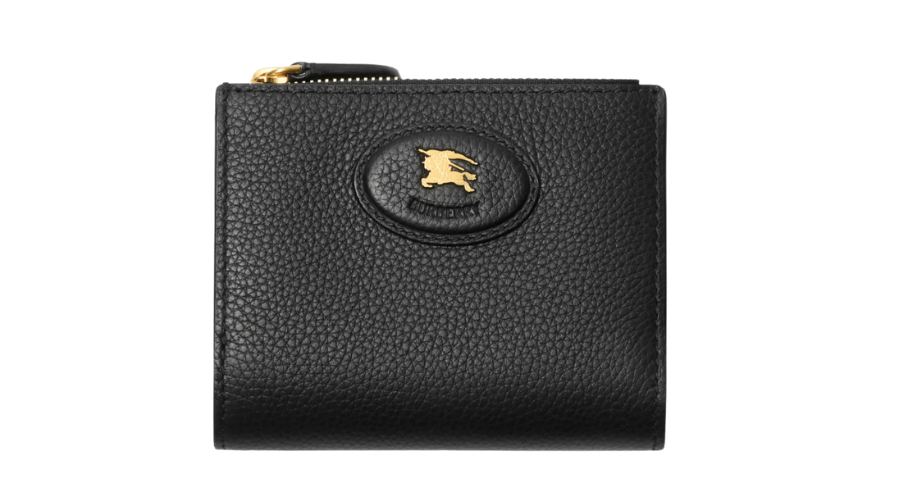 A black textured leather wallet with a gold zipper and an embossed oval patch featuring a gold emblem of a horse and rider on the front.
