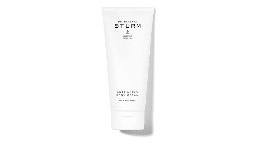 A white tube labeled Dr. Barbara Sturm Anti-Aging Body Cream with minimal black text on a plain white background.