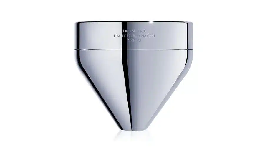 A sleek, metallic, cone-shaped container with a reflective surface and the text LIFE MATRIX HAUTE REJUVENATION CREAM etched near the top. The background is plain white.