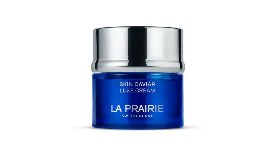 A blue jar of La Prairie Skin Caviar Luxe Cream with a shiny silver lid and white text, displayed against a plain white background.