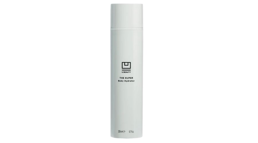 A tall, cylindrical white bottle with minimal black text that reads U Beauty THE SUPER Body Hydrator on the front, standing upright against a plain white background.