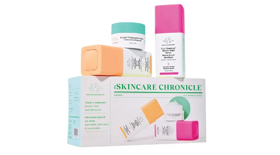 Drunk Elephant skincare products are artfully arranged on top of The Skincare Chronicle box.